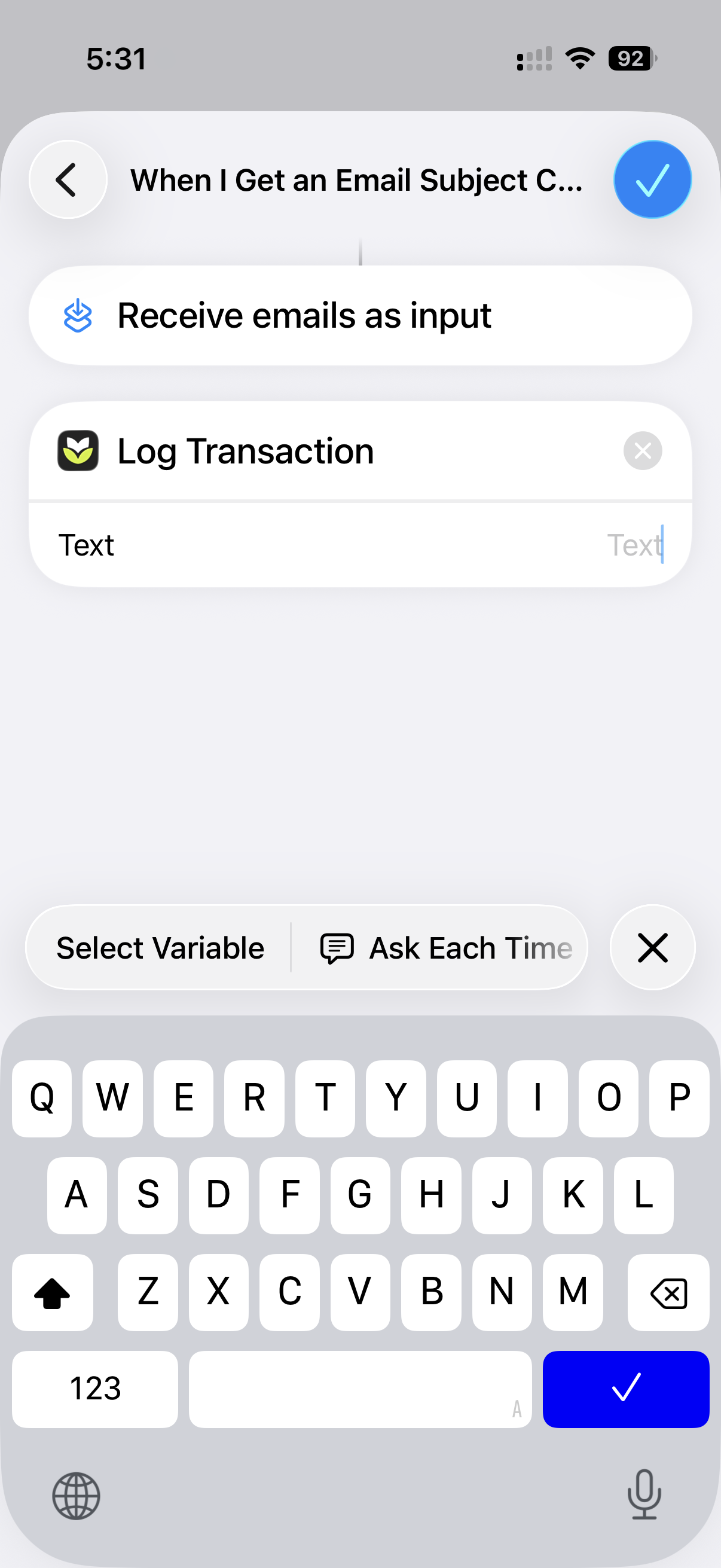 The Log Transaction action's Text field selected, with the Select Variable bar above the keyboard.